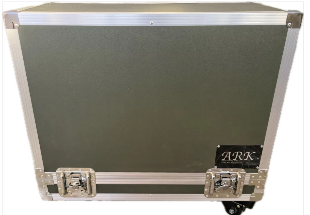 ARK amp case with moss green panels and a silver frame